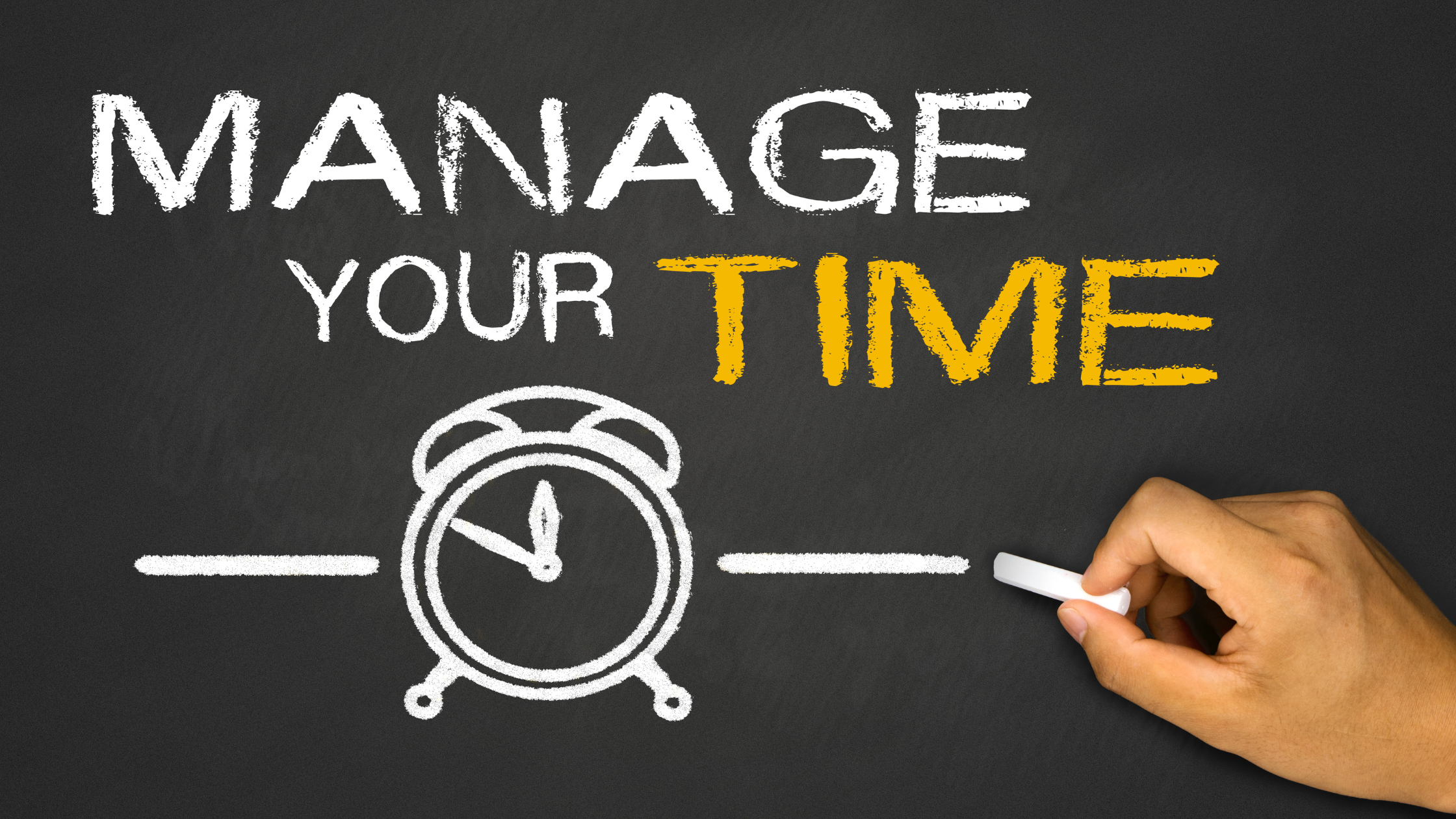 Hand drawing a clock with the words “Manage Your Time” on a chalkboard.