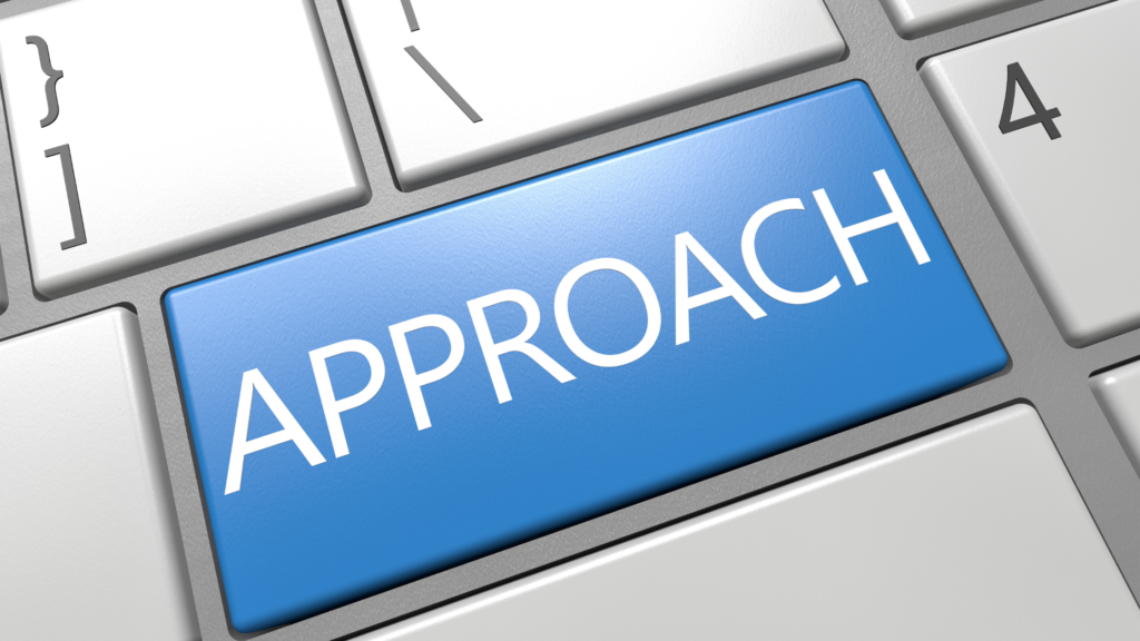 Computer keyboard with a blue key labeled “Approach” symbolizing strategic planning.